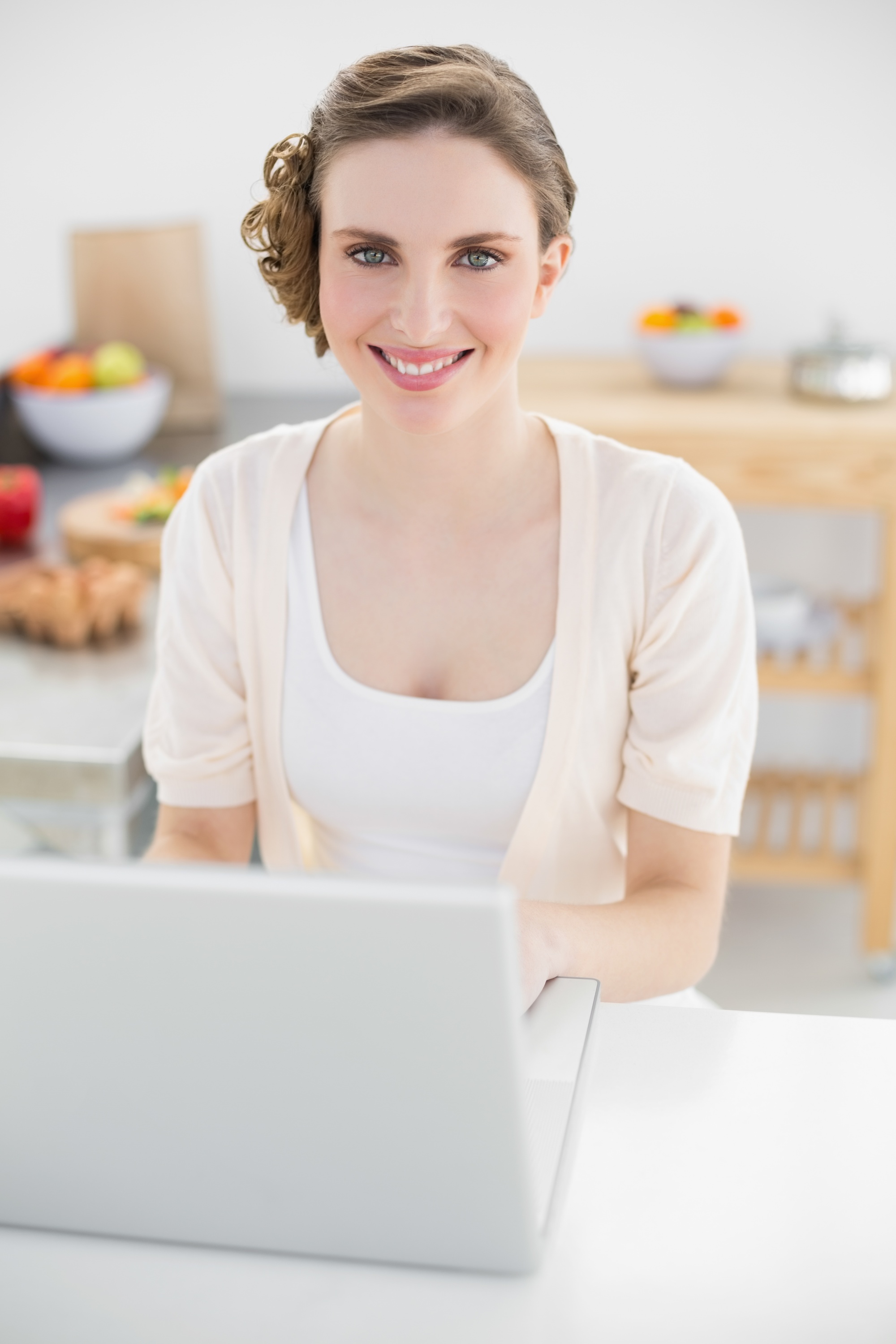 Instructor smiling while explaining a recipe to students