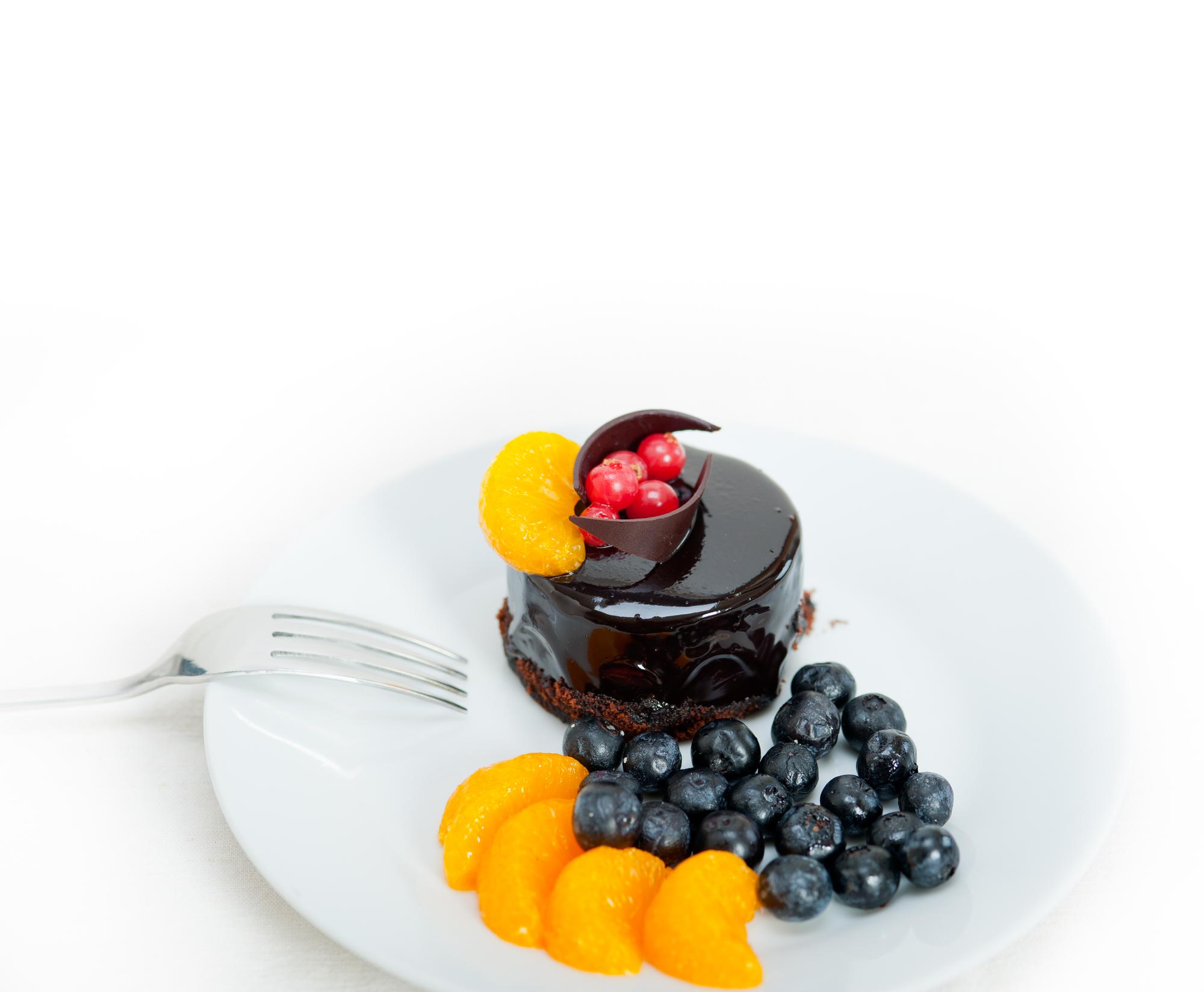 Finished desserts on a counter with garnish
